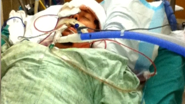 Aurora victim in ICU as wife prepares to give birth