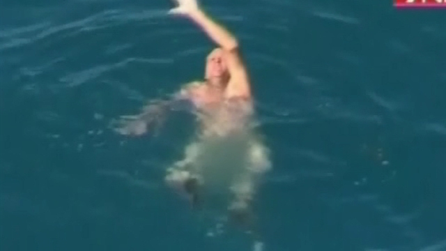 Dramatic rescue of fisherman from circling shark