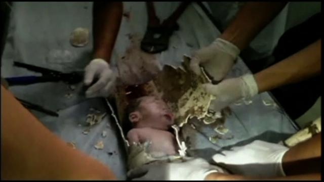Baby rescued alive from sewer pipe in China