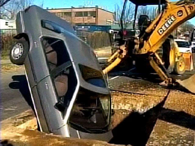 Car Stuck In A Hole