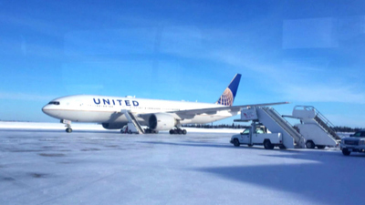 CBS This Morning - Stranded United travelers spend night on jet
