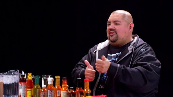 Hot Ones - Gabriel Iglesias Does Wrestling Trivia While Eating Spicy Wings