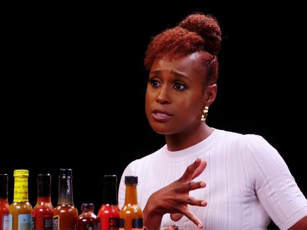 Hot Ones - Issa Rae Raps While Eating Spicy Wings