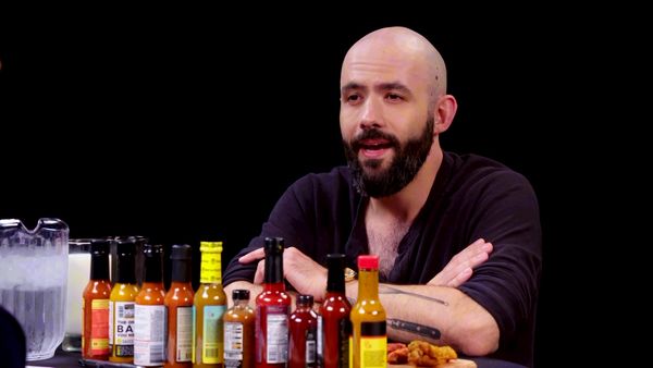 Hot Ones - Binging with Babish Gets a Tattoo While Eating Spicy Wings