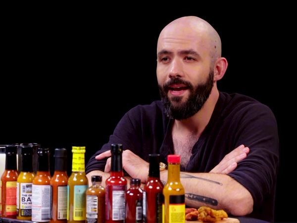 Hot Ones - Binging with Babish Gets a Tattoo While Eating Spicy Wings