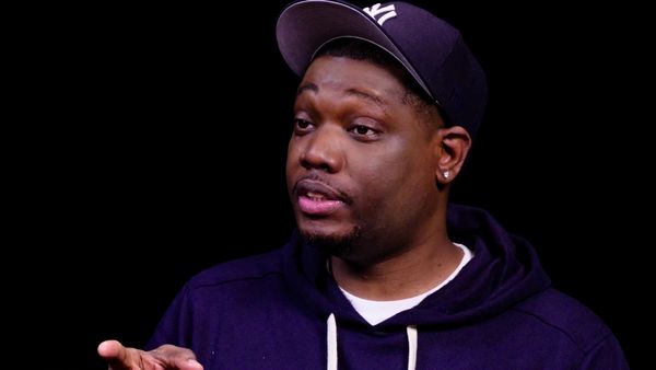 Hot Ones - Michael Che Gs Up While Eating Spicy Wings