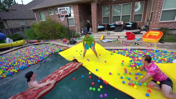 Unspeakable - The Biggest Backyard Water Slide Challenge / Last to Leave the Pool Wins $10,000!