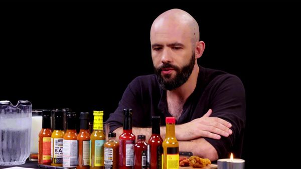 Hot Ones - Binging with Babish Gets a Tattoo While Eating Spicy Wings